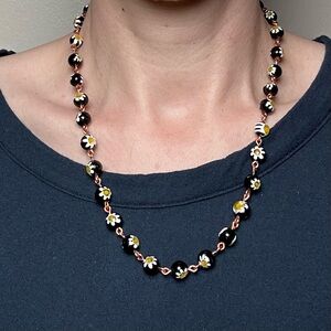 Floral necklace handmade glass beads copper wire black and yellow
